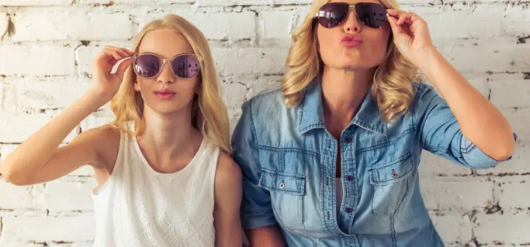 Mother and teen daughter in sunglasses